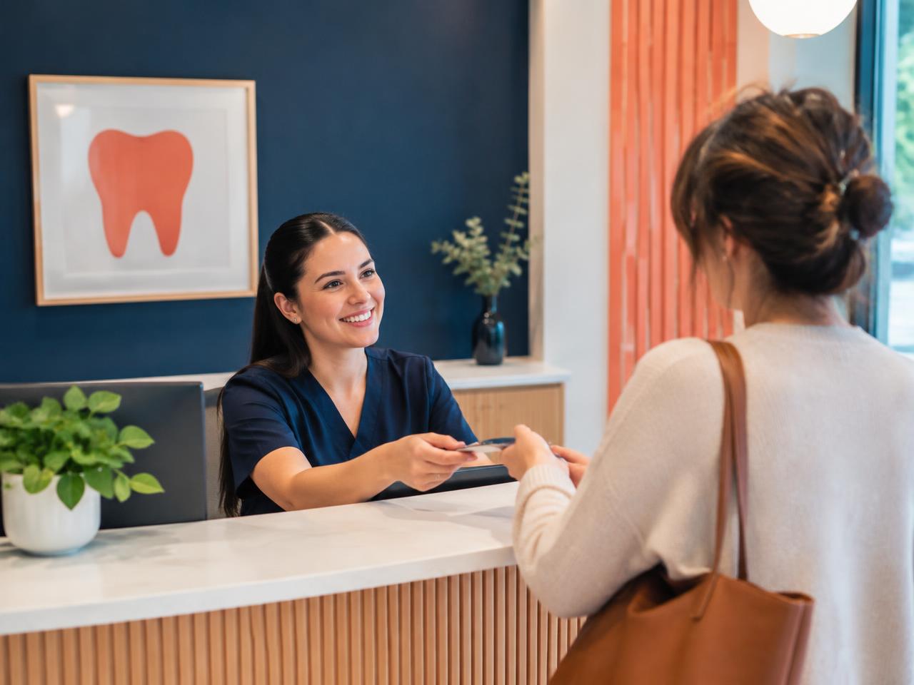Dental receptionist helping a patient at the front desk