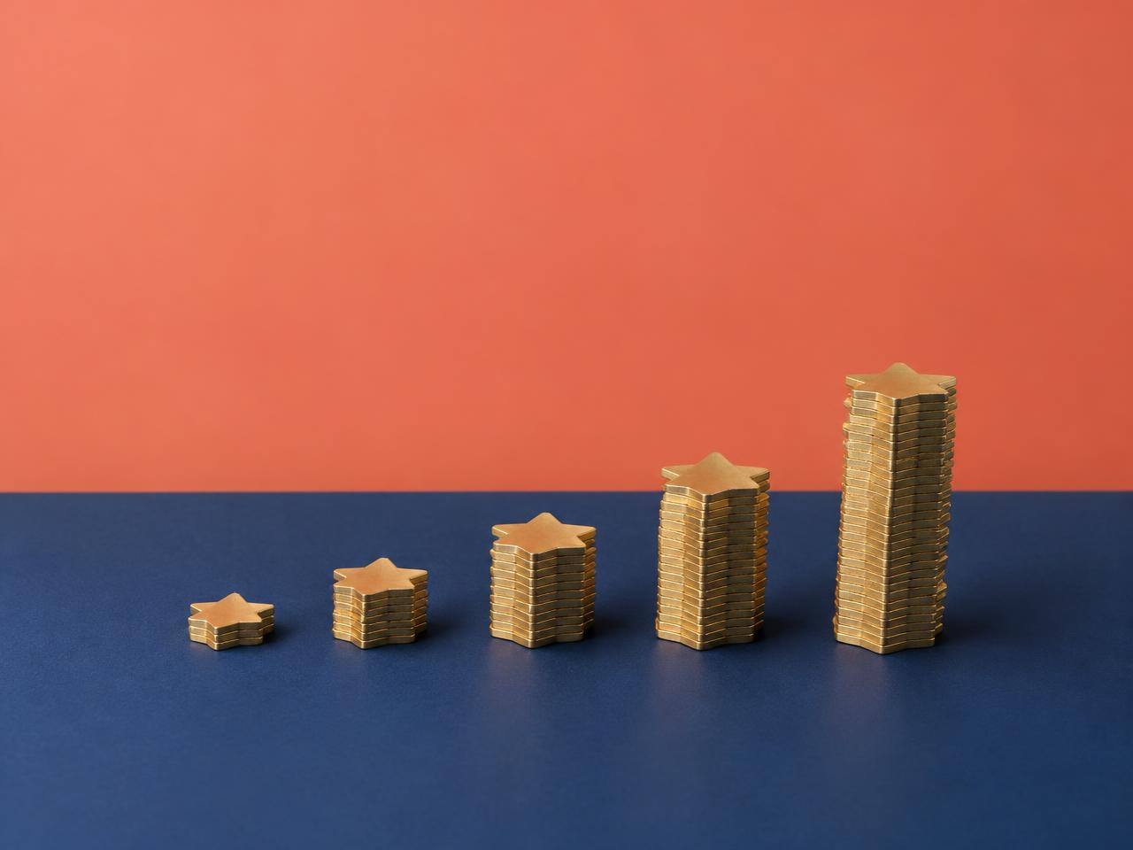 Stacks of gold stars growing in height